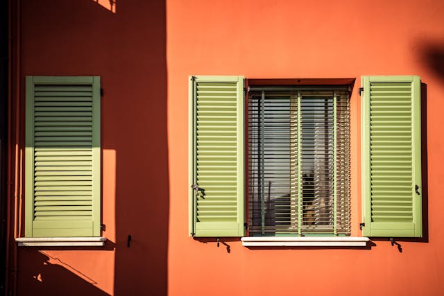 an%20orange%20house%20with%20green%20window%20shutters an%20orange%20house%20with%20green%20window%20shutters